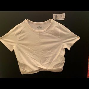 Hollister white midriff tshirt with twist front.